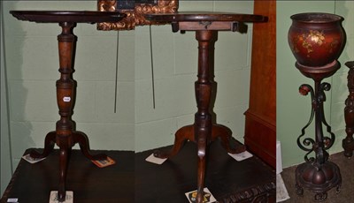 Lot 1134 - George III walnut tilt-top tripod table; together with a mahogany example; and toleware planter...