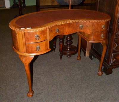 Lot 1146 - Reproduction walnut reniform desk