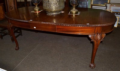 Lot 1156 - A reproduction mahogany windout table on ball and claw feet