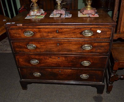 Lot 1159 - A George III mahogany chest of drawers, the rectangular cross banded top above four graduated...