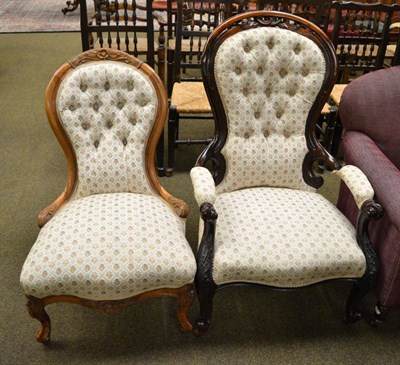 Lot 1165 - A Victorian mahogany framed button backed open arm chair together with a similar nursing chair (2)