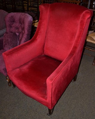 Lot 1167 - A Georgian style red upholstered armchair