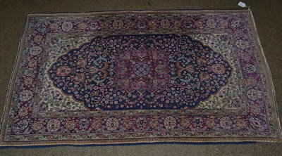 Lot 1171 - Indo-Persian rug, the indigo floral field within conforming narrow borders, 162cm by 97cm