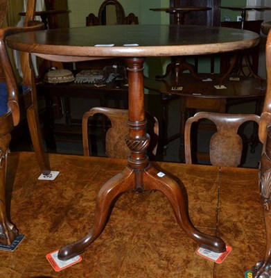 Lot 1198 - George III mahogany fold over tripod table