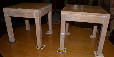 Lot 1200 - A pair of limed oak side tables carved with a recessed squirrel