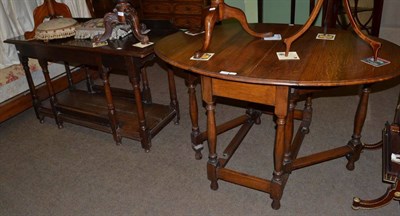 Lot 1205 - An oak low dresser, 18th century and later, together with an oak gateleg drop leaf table