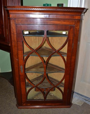 Lot 1208 - A George III glazed hanging corner cupboard