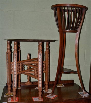 Lot 1211 - Mahogany plant stand; together with a brass top Indian folding table