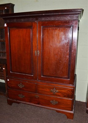 Lot 1212 - A mahogany linen press of small proportions