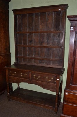 Lot 1213 - An oak low dresser and rack of small proportions