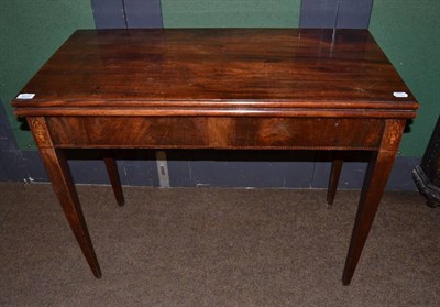 Lot 1217 - An early 19th century mahogany inlaid tea table