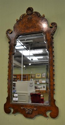 Lot 1222 - A 19th century walnut fret cut mirror