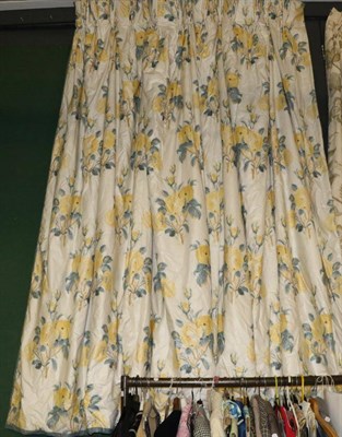 Lot 1257 - Two pairs of yellow floral glazed cotton curtains with tie backs, lined and interlined