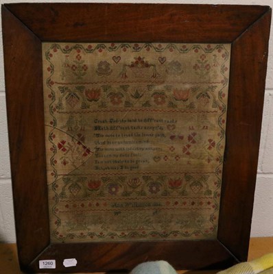 Lot 1260 - A 19th century needlework sampler by Ann Wilkinson 1834, with central religious verse surrounded by