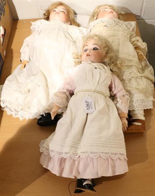 Lot 1267 - German bisque socket head doll impressed 394, with blond wig, pierced ears, open mouth,...