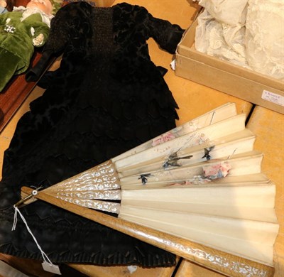 Lot 1273 - A Victorian dolls dress and a painted silk fan (2)