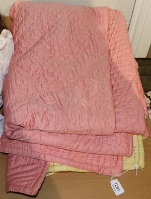 Lot 1291 - A pink and yellow reversible satinised cotton quilt, 255cm by 180cm