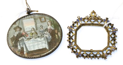 Lot 1353 - A steel framed pendant hand mirror, late 17th century, the reverse with colour engraving...