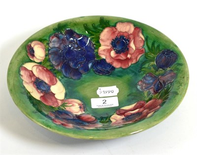 Lot 2 - A Walter Moorcroft dish, in the anemone pattern, signed, 25cm in diameter