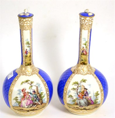 Lot 37 - A pair of Dresden vases and covers decorated with vignettes of courting couples, circa 1840/50