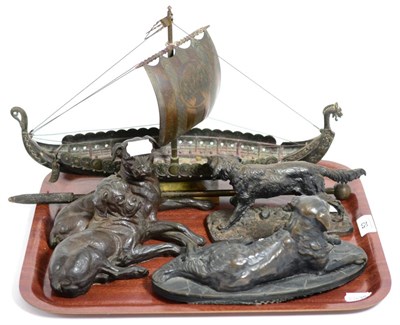 Lot 52 - A bronze model of a gun dog, together with a further two patinated metal groups of recumbent...