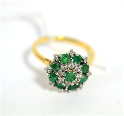 Lot 72 - An emerald and diamond cluster ring, total estimated diamond weight 0.20 carat approximately,...