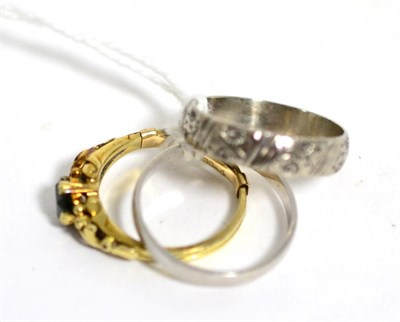 Lot 76 - A platinum band ring, finger size Q; an 18 carat white gold band ring, finger size Q and a...