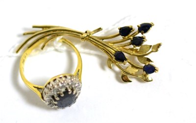 Lot 89 - An 18 carat gold sapphire and diamond ring, finger size K and a 9 carat gold sapphire spray brooch