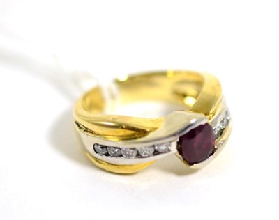 Lot 91 - A ruby and diamond ring, an oval cut ruby in a half rubbed over setting, to channel set diamond...