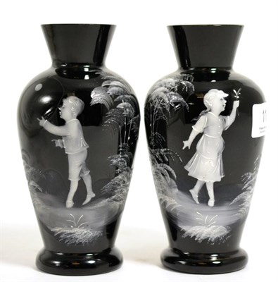 Lot 113 - A pair of Mary Gregory black glass vases