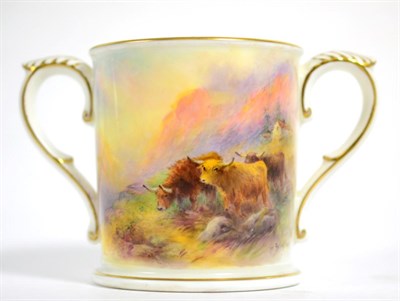 Lot 115 - A Royal Worcester loving cup painted by H Stinton decorated with highland cattle