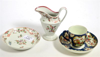 Lot 121 - An 18th century Worcester tea cup and saucer together with an 18th century Newhall cream and saucer