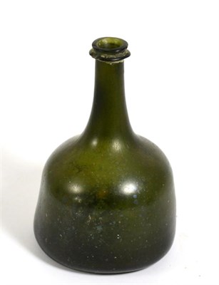 Lot 123 - An 18th century green glass mallet form bottle
