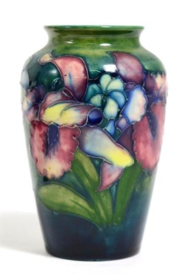 Lot 126 - A Walter Moorcorft small vase, decorated with orchids and Spring flowers