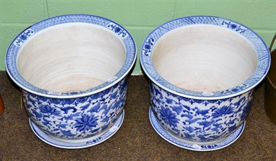 Lot 149 - A pair of modern Chinese blue and white porcelain jardinieres and stands