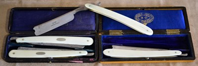Lot 185 - A pair of Joseph Rodgers & Sons, Sheffield cut-throat razors with ivory handles, each blade...
