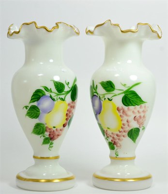 Lot 2 - A Victorian enamelled green glass lidded bowl and a pair of fruit painted opaque vases