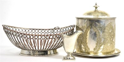 Lot 5 - A silver helmet shaped cream jug; a Victorian plated biscuit box; and a Sheffield plate bread...