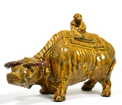 Lot 15 - A Chinese pottery model of a monkey astride a water buffalo