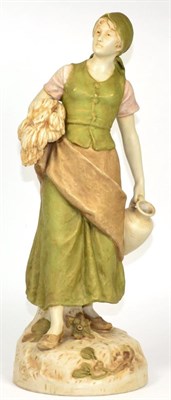 Lot 24 - A Royal Dux figure of a water carrier
