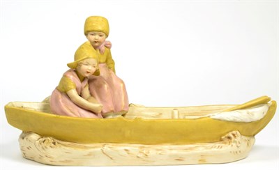 Lot 25 - A Royal Dux model of children in a boat