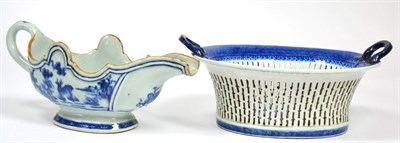 Lot 26 - A Chinese porcelain sauce boat, Qianlong, of silver shape, painted in underglaze blue with a...