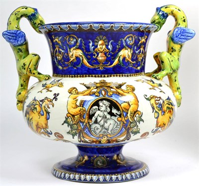 Lot 46 - A 19th century French tin glazed twin dragon handled vase
