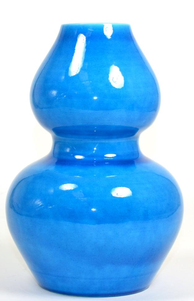 Lot 54 - A Chinese blue glazed double gourd vase