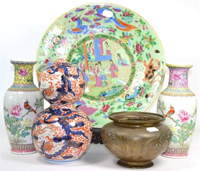 Lot 57 - A 19th century Canton famille rose charger (a.f.); Japanese Imari double gourd vase; a pair of...