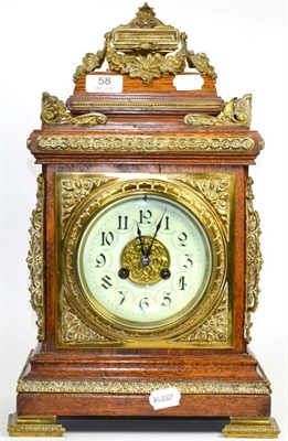 Lot 58 - An oak and brass mounted striking mantel clock circa 1890