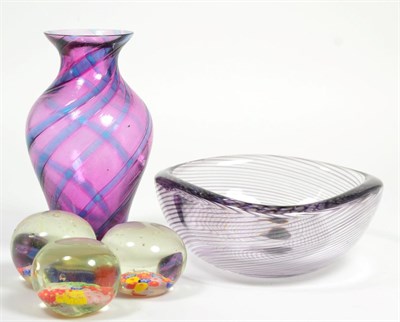 Lot 59 - A Kosta Boda glass bowl, three Millefiori paperweights and a small art glass vase