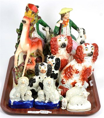 Lot 65 - A group of Staffordshire including a flat back group of a deer and fawn, a pair of flat back...