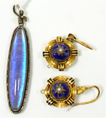 Lot 76 - A pair of Victorian seed pearl and enamel earrings, a star set pearl within a blue enamel dome to a