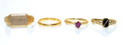 Lot 77 - A ruby and diamond three stone ring, an oval cut ruby spaced by round brilliant cut diamonds,...